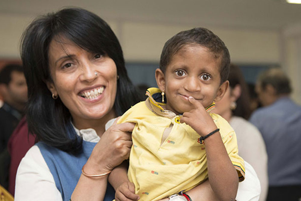 Mamta Carroll with a Smile Train patient