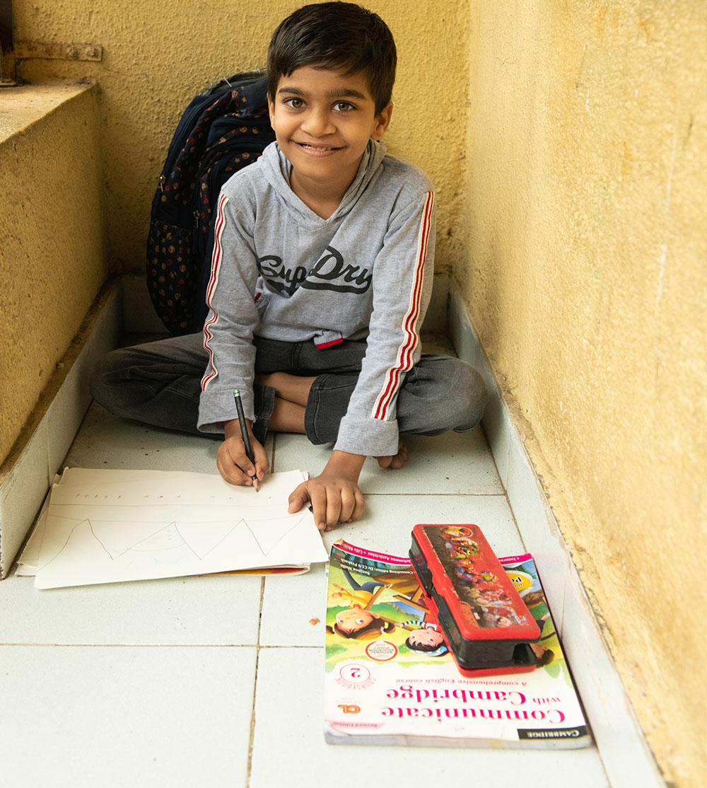 Samrat smiling and coloring