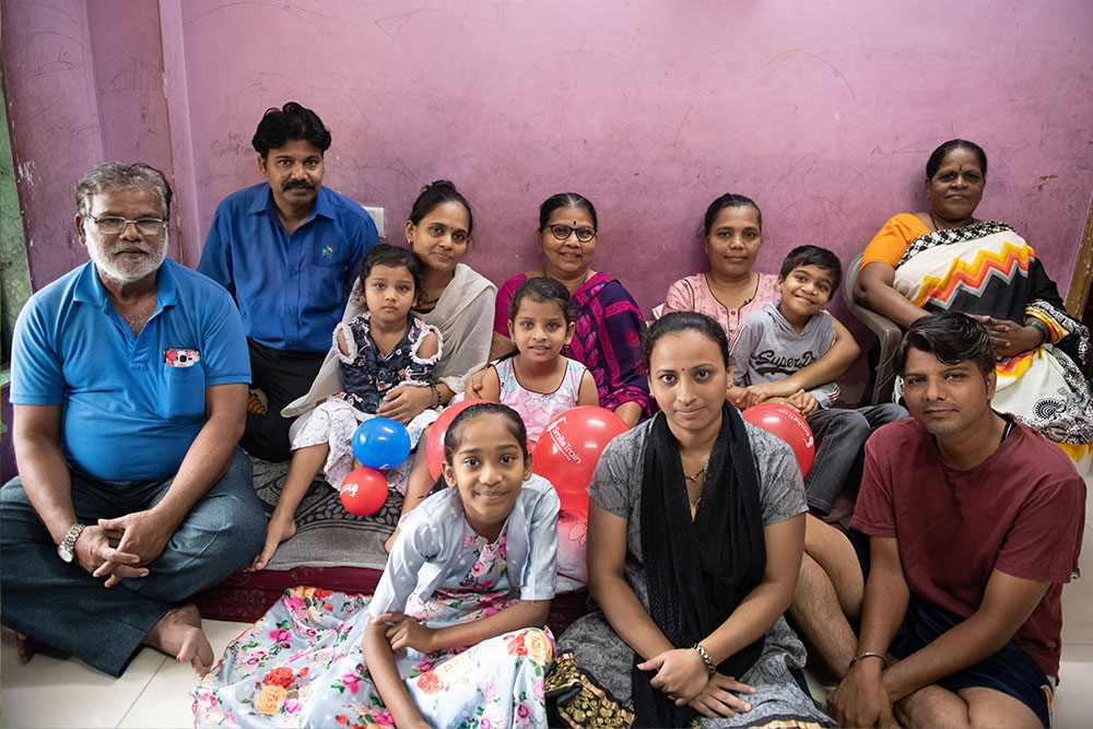 Samrat smiling at home with his large, loving family