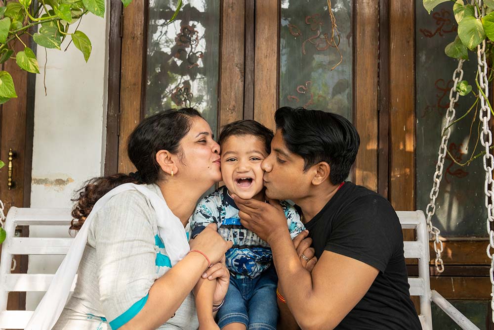 Saksham gets a kiss from mom and dad