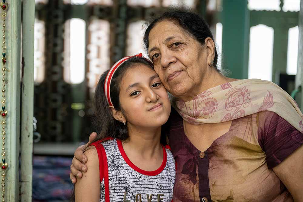 Angel and her grandmother Shubhlata smile for the camera