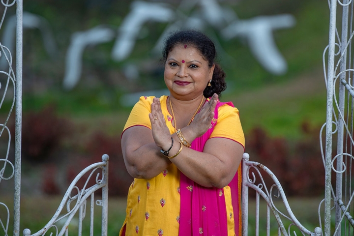 Dr. Neela making the #BreakTheBias hand symbol for International Women's Day