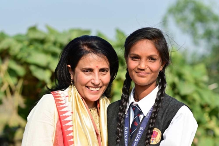 Mamta Carroll smiling and hugging Pinki