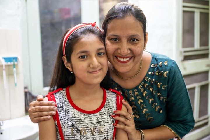 Angel and her mother, Aarti, smile for the camera