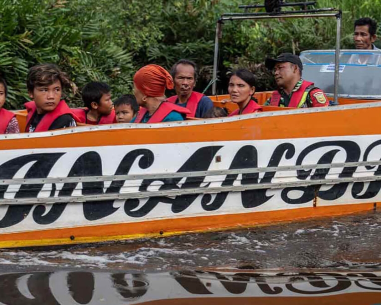 Speedboat taking alim, rajib, and family members to facility for cleft care